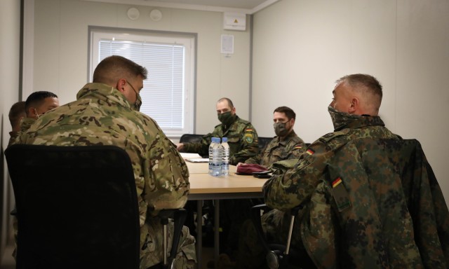 2nd Battalion, 8th Cavalry Regiment “Stallions” Commander Lt. Col. Steven Jackowski meets with German liaison officer for NATO enhanced Forward Pressence, Battlegroup Lithuania, during a meet and greet Dec. 4, 2020, at the Pabrade Training...