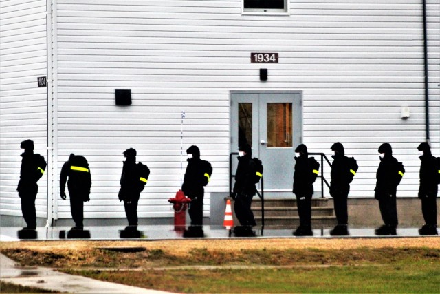 U.S. Navy recruits walk to their barracks Oct. 22, 2020, at Fort McCoy, Wis. The Navy’s Recruit Training Command (RTC) of Great Lakes, Ill., worked with the Army at Fort McCoy so the post could serve as a restriction-of-movement (ROM) site for...