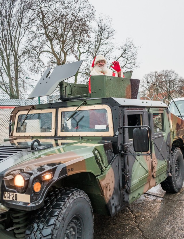 WIESBADEN, Germany-Operation Santa's Flight begins in the Hainerberg neighborhood with Santa arriving on a HUMVEE.