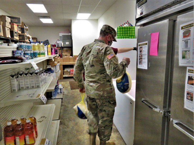 Fort McCoy Garrison Commander Col. Michael D. Poss helps put away donated turkeys Nov. 9, 2020, at the Couleecap Food Pantry in Sparta, Wis. Personnel with Headquarters and Headquarters Company, U.S. Army Garrison Fort McCoy donated food as part...