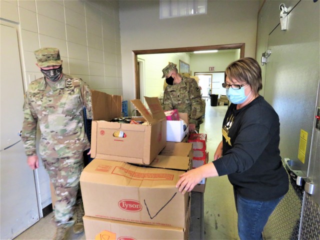 Fort McCoy, Wis., Soldiers drop off food Nov. 9, 2020, at the Neighbor for Neighbor Food Pantry in Tomah, Wis. Personnel with Headquarters and Headquarters Company, U.S. Army Garrison Fort McCoy completed the effort as part of a holiday food...