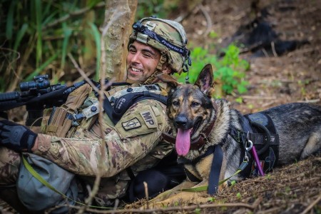 A Patrol Explosive Detector Dog team from the 13th/520th Military Police Detachment serve as integral assets during Exercise Lightning Forge 2020 at the Kahuku Training Area, Hawaii, July 2020. 