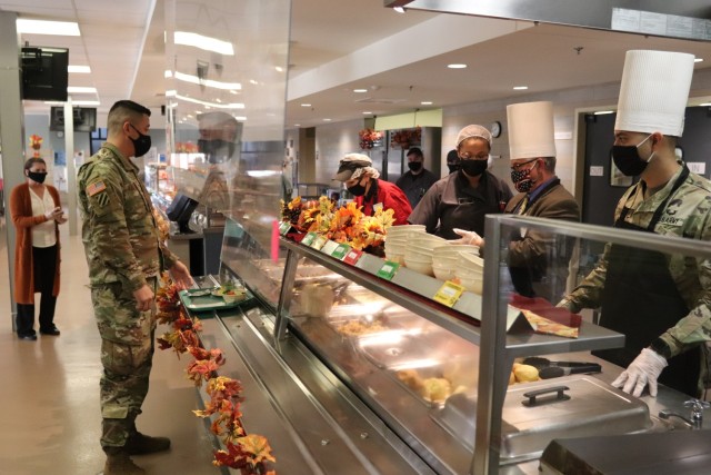 Soldiers receive plates of food during the annual Fort McCoy Thanksgiving meal Nov. 19, 2020, at the Noncommissioned Officer Academy Dining Facility on the cantonment area at Fort McCoy, Wis. The meal included all the traditional Thanksgiving...