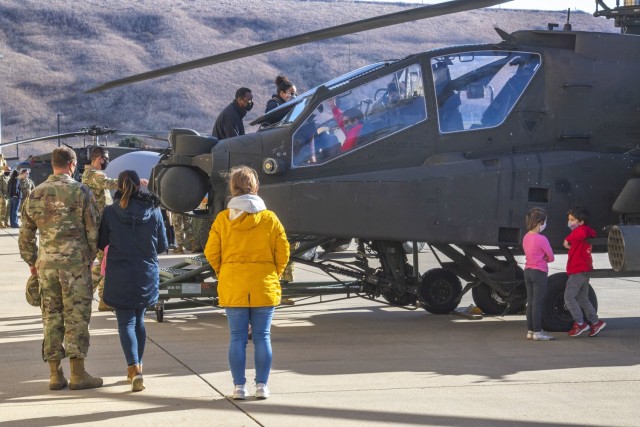 Families of Soldiers attached to 1st Combat Aviation Brigade have an opportunity to learn more about other airframes and weapon systems on Dec. 5, 2020, in Fort Riley, Kansas. Families were encouraged to be hands-on with the static displays. U.S. Army photo by Sgt. Joshua Oh, 19th Public Affairs Detachment