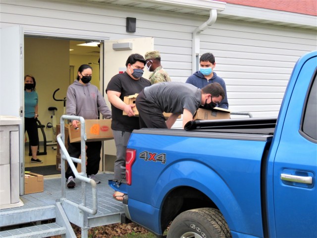 Fort McCoy, Wis., employees and Soldiers load donated food to be taken to food pantries in Sparta and Tomah, Wis., on Nov. 9, 2020, at the installation. Headquarters and Headquarters Company, U.S. Army Garrison Fort McCoy, personnel completed a...