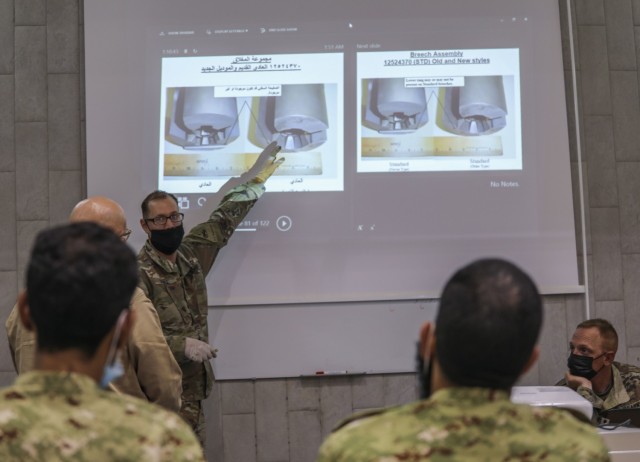 Staff Sgt. Christopher Doyle, 2nd Armored Brigade Combat Team, 1st Armored Division, brigade master gunner instructs Soldiers from the Kuwait National Guard on the M242 Bushmaster near Kuwait City, Kuwait, November 29, 2020. 2ABCT is deployed to...