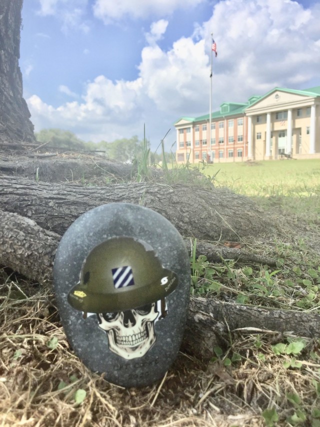 Leadership can often be seen in the small things. The “Rock of the DOC,” created by Maj. Steve Orbon, 3rd Infantry Division, is an award given for support beyond the call of duty to the division operations center. (U.S. Army photo by Staff...