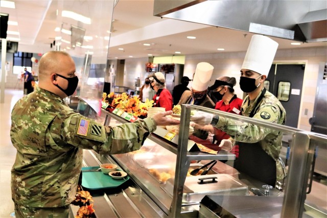 A Soldier receives a plate of food during the annual Fort McCoy Thanksgiving meal Nov. 19, 2020, at the Noncommissioned Officer Academy Dining Facility on the cantonment area at Fort McCoy, Wis. The meal included all the traditional Thanksgiving...