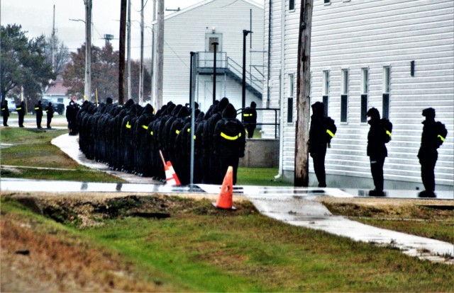 U.S. Navy recruits walk to their barracks Oct. 22, 2020, at Fort McCoy, Wis. The Navy’s Recruit Training Command (RTC) of Great Lakes, Ill., worked with the Army at Fort McCoy so the post could serve as a restriction-of-movement (ROM) site for...