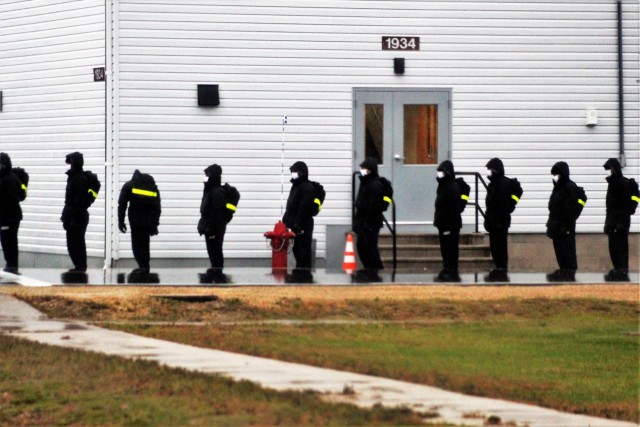 U.S. Navy recruits walk to their barracks Oct. 22, 2020, at Fort McCoy, Wis. The Navy’s Recruit Training Command (RTC) of Great Lakes, Ill., worked with the Army at Fort McCoy so the post could serve as a restriction-of-movement (ROM) site for...