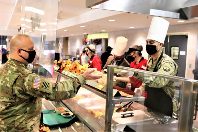 A Soldier receives a plate of food during the annual Fort McCoy Thanksgiving meal Nov. 19, 2020, at the Noncommissioned Officer Academy Dining Facility on the cantonment area at Fort McCoy, Wis. The meal included all the traditional Thanksgiving...