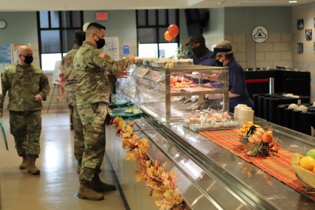 A Soldier receives a plate of food during the annual Fort McCoy Thanksgiving meal Nov. 19, 2020, at the Noncommissioned Officer Academy Dining Facility on the cantonment area at Fort McCoy, Wis. The meal included all the traditional Thanksgiving...