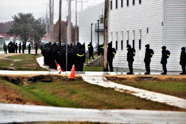 U.S. Navy recruits walk to their barracks Oct. 22, 2020, at Fort McCoy, Wis. The Navy’s Recruit Training Command (RTC) of Great Lakes, Ill., worked with the Army at Fort McCoy so the post could serve as a restriction-of-movement (ROM) site for...