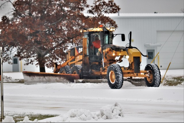 A grader operator moves snow Nov. 14, 2019, at Fort McCoy, Wis. Fort McCoy emergency management officials recommend people be ready for traveling in winter as well as be ready for winter emergencies. (U.S. Army Photo by Scott T. Sturkol, Public...