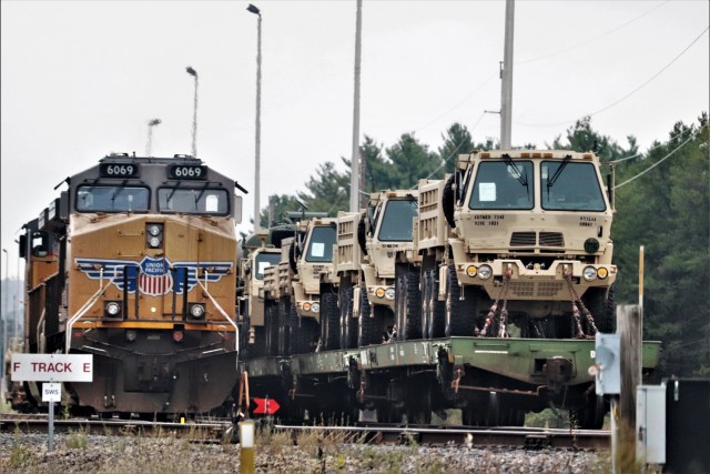 A locomotive for the Canadian-Pacific Railway is parked on a side rail in between moving railcars Sept. 27, 2019, at Fort McCoy, Wis. Military vehicles and equipment belonging to the 829th Engineer Company were loaded on railcars to be shipped for...