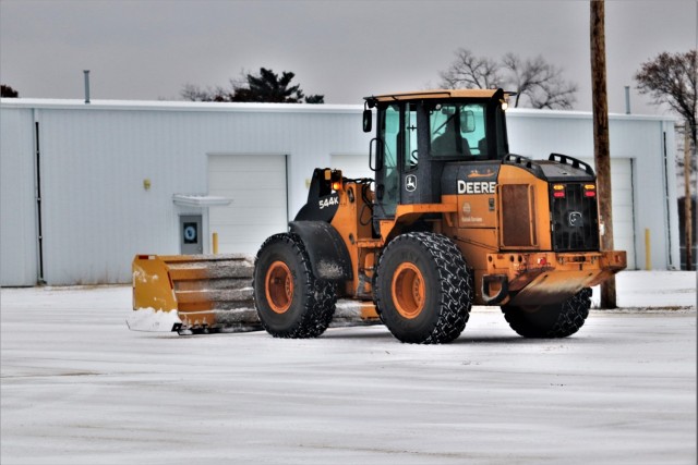 A lift operator moves snow after a fresh snowfall Nov. 14, 2019, at Fort McCoy, Wis. Fort McCoy emergency management officials recommend people stay prepared for winter weather by having a plan and the right supplies ready for any winter...