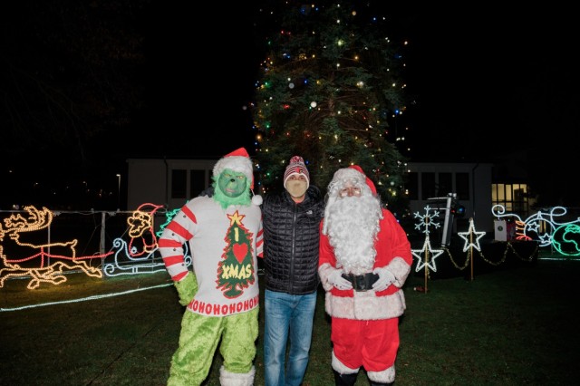 WIESBADEN, Germany - U.S. Army Garrison Commander Col. Mario Washington, Santa and the Grinch after the tree-lighting ceremony Dec. 4 at Clay Kaserne.