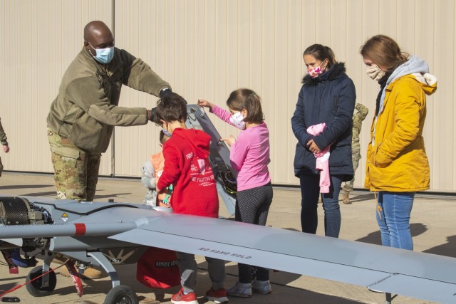 Families of Soldiers attached to 1st Combat Aviation Brigade have a chance to explore the different technologies utilized within Army aviation on Dec. 5, 2020, in Fort Riley, Kansas. 1CAB hosted the event to give an opportunity for Families to learn more about what their Soldier does as a profession. U.S. Army photo by Sgt. Joshua Oh, 19th Public Affairs Detachment