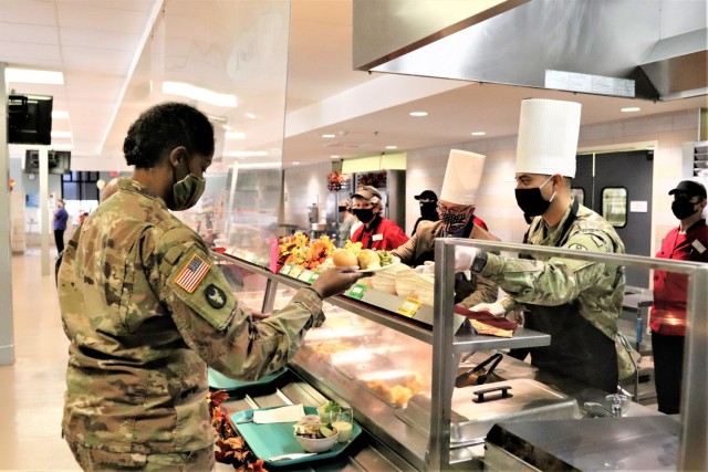 A Soldier receives a plate of food during the annual Fort McCoy Thanksgiving meal Nov. 19, 2020, at the Noncommissioned Officer Academy Dining Facility on the cantonment area at Fort McCoy, Wis. The meal included all the traditional Thanksgiving...