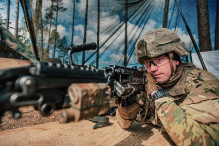 A U.S. Soldier, assigned to 3rd Squadron, 2d Cavalry Regiment, performs a functions check for a M249 Squad Automatic Weapon as part of the testing phase for the Expert Infantryman Badge and the Expert Soldier Badge in Bemowo Piskie, Poland, March 31, 2020.