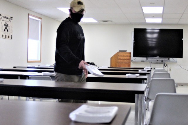 Instructor Joe Ernst sets up a classroom for the Cold-Weather Operations Course (CWOC) training facility Dec. 3, 2020, at Fort McCoy, Wis. CWOC students are trained on a variety of cold-weather subjects, including snowshoe training and skiing as...