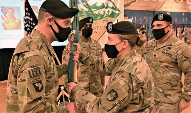 Lt. Col. Michael F. Dyer, incoming commander, 1st Space Battalion, receives the battalion colors from Lt. Col. Whitney Hall, 1st Space Brigade executive officer-in-charge, during a Change of Command at Fort Carson, Colorado, Dec. 4. There ceremony...
