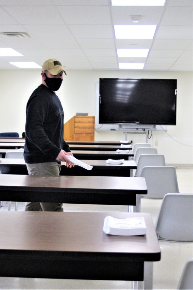 Instructor Joe Ernst sets up a classroom for the Cold-Weather Operations Course (CWOC) training facility Dec. 3, 2020, at Fort McCoy, Wis. CWOC students are trained on a variety of cold-weather subjects, including snowshoe training and skiing as...