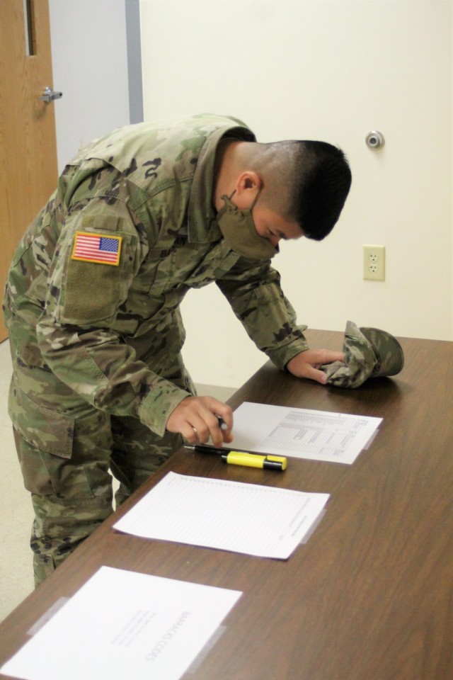 A Soldier signs up to be a student for the Cold-Weather Operations Course (CWOC) on Dec. 3, 2020, at Fort McCoy, Wis. CWOC students are trained on a variety of cold-weather subjects, including snowshoe training and skiing as well as how to use...