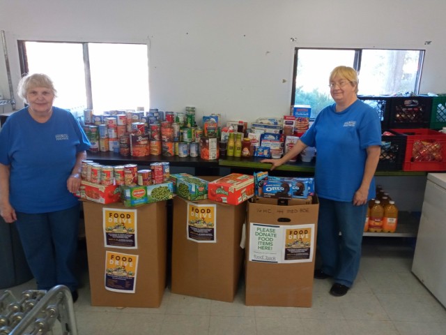 Various units and organizations across Fort Bragg came together in friendly competition to gather the most food donations during the Base Wide Food Drive. Members from the Five N Two Pantry in Sanford, N.C., stand next to donated food items provided by Fort Bragg to help the local community during a time of need.