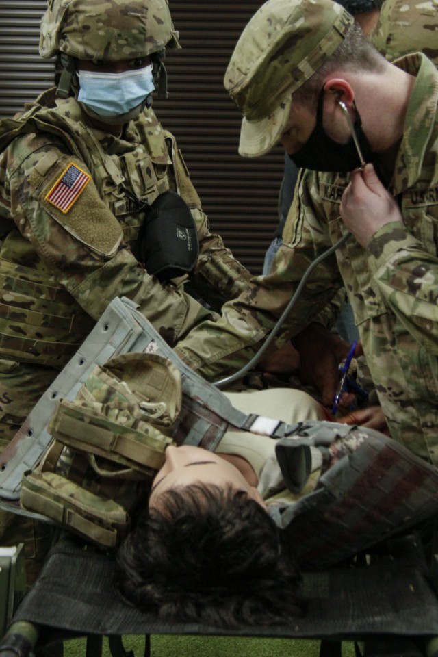 Capt. Daniel Karakas (right), a medical corps officer at Winn Army Community Hospital, checks a trial female mannequin for breathing, while Spc. Ekya Graham, an aviation operation specialist assigned to 2nd Battalion, 3rd Aviation Regiment, holds...