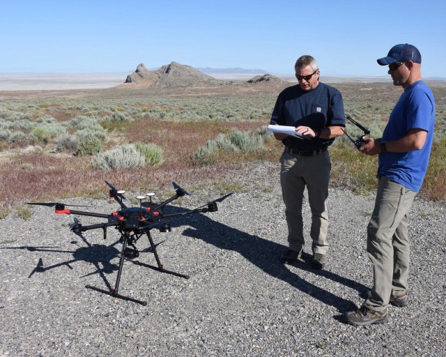 Project team members prepare to launch a small unmanned aircraft system (sUAS) to observe golden eagle nests on Dugway Proving Ground. The nests were observed for two years using three platforms to determine the strengths and weaknesses of each...