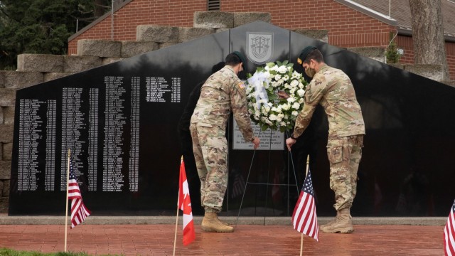 JOINT BASE LEWIS-MCCHORD, Wash. - The 1st Special Forces Group (Airborne) commander and command sergeant major, Col. Ryan Ehrler and Command Sgt. Maj. Daniel Orosco, lay a wreath in front of the 1st SFG (A) Memorial Wall at Joint Base Lewis McChord, Wash., Dec. 7, 2020, in remembrance of and to honor special operations soldiers who gave their lives while freeing the oppressed. Menton Week celebrates the Special Forces heritage, as its predecessor was the First Special Service Force, which disbanded in Menton, France at the end of World War II on Dec. 5, 1944. The unit, commonly referred to as the “Devils Brigade,” is credited with a distinguished record of unconventional operations behind enemy lines. (U.S. Army photos by Pfc. Thoman Johnson, Public Affairs, 1st SFG (A))
