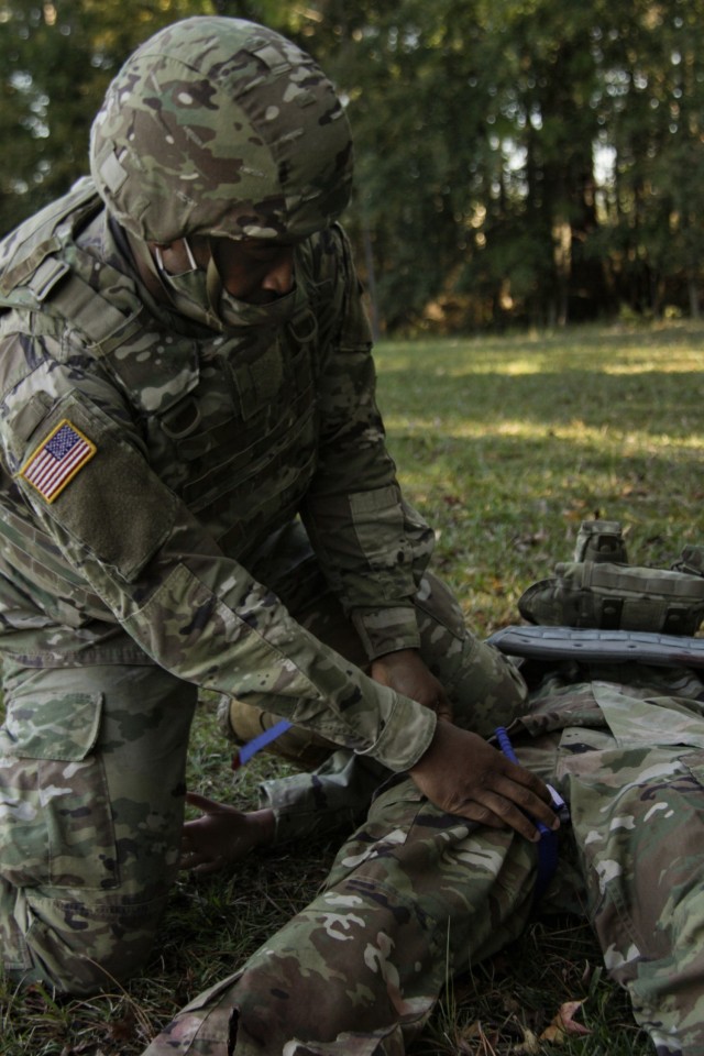 Sgt. Lawrence Lovejoy, a combat medic assigned to 3rd Squadron, 17th Cavalry Regiment, applies a tourniquet to a female mannequin during a training exercise at the Medical Simulation Training Center on Fort Stewart, Georgia, Dec. 2, 2020. The...