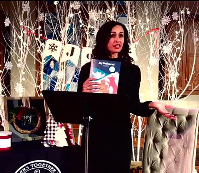 Guest speaker Pernita Mukes delivers a message about joy during the Protestant Women of the Chapel's Joy to the World Christmas Program Dec. 8 at Frontier Chapel. The event was attended in person only by those conducting the service and was...