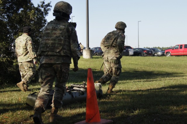 Sgt. Lawrence Lovejoy, a combat medic assigned to 3rd Squadron 17th Cavalry Regiment at Hunter Army Airfield, runs with a female mannequin strapped onto a sled during a training exercise at the Medical Simulation Training Center on Fort Stewart,...