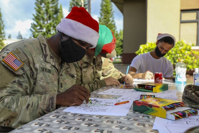 Soldiers and Families with 1st Battalion, 27th Infantry Regiment "Wolfhounds", 2nd Infantry Brigade Combat Team, 25th Infantry Division, create art and ornaments to send to the Holy Family Home orphanage on December 4, 2020 at Schofield Barracks, Hawaii. 1-27 IN and the Holy Family Home orphanage in Osaka, Japan, have an enduring relationship dating back to just after World War II, when Soldiers took up a collection for the orphanage during the holiday season in 1949. (U.S. Army photo by Staff Sgt. Thomas Calvert)