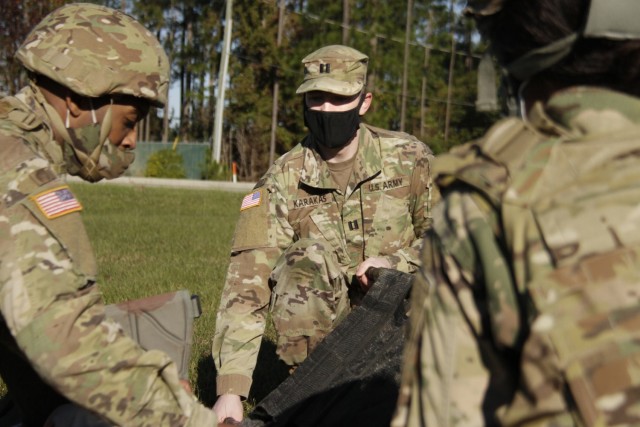 Capt. Daniel Karakas, a medical corps officer at Winn Army Community Hospital, instructs Soldiers on how to set up a litter during a training exercise at the Medical Simulation Training Center on Fort Stewart, Georgia, Dec. 2, 2020. The training...