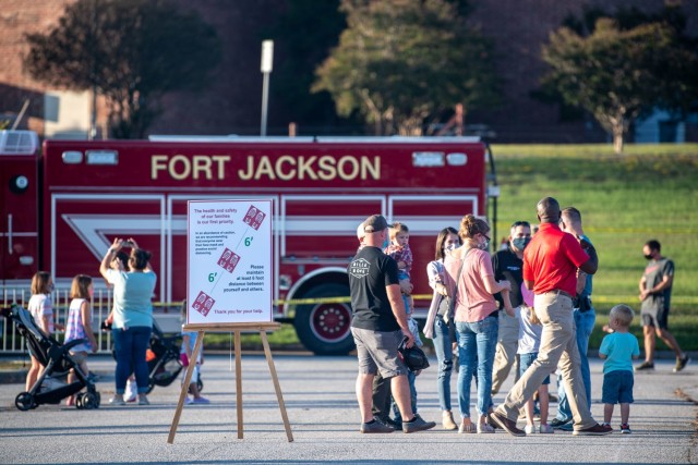 Fort Jackson community members speak with law enforcement and members of Fort Jackson Fire Department during the National Night Out earlier this year