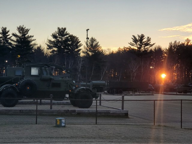 A frosty morning is slowly warmed with the rays of the sun glowing through the trees Dec. 10, 2020, at the Equipment Park in the historic Commemorative Area at Fort McCoy, Wis.  Morning temperatures in the 20s caused widespread frost. (U.S. Army...