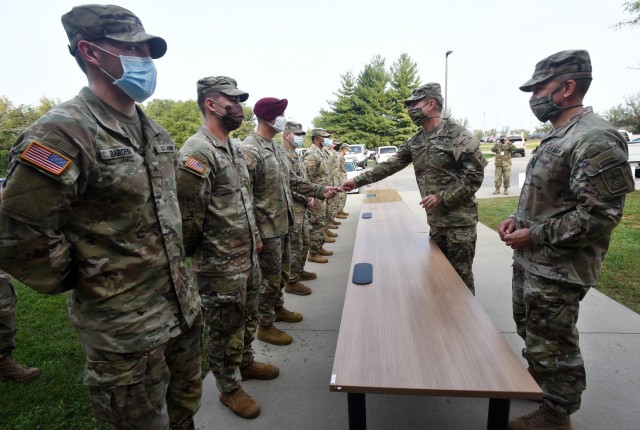 Army Chief of Staff James McConville and the Army’s senior enlisted advisor, Sgt. Maj. of the Army Michael Grinston, hand out coins at the Army&#39;s Colonels Command Assessment Program Sept. 17, 2020 at Fort Knox, Ky., to Soldiers who have been instrumental in ensuring the success of the program. (Photo Credit: Eric Pilgrim, Fort Knox News)