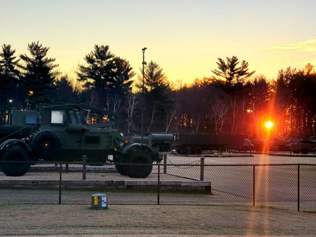 A frosty morning is slowly warmed with the rays of the sun glowing through the trees Dec. 10, 2020, at the Equipment Park in the historic Commemorative Area at Fort McCoy, Wis.  Morning temperatures in the 20s caused widespread frost. (U.S. Army...