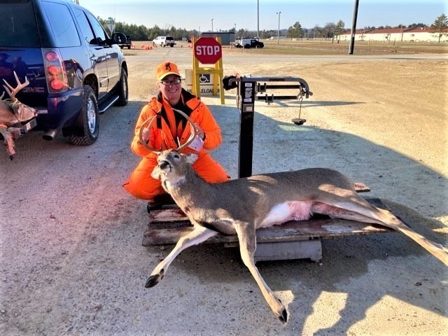 A hunter is shown with a whitetail buck Nov. 23, 2020, taken during the 2020 gun-deer season at Fort McCoy, Wis. Nearly 300 deer were harvested during the season, meeting deer management goals by post natural resources management officials....