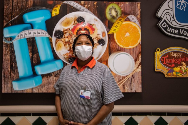 Johnsey Rice, a dining room shift leader, poses for a photo during the Thanksgiving meal at her DFAC Nov. 25.