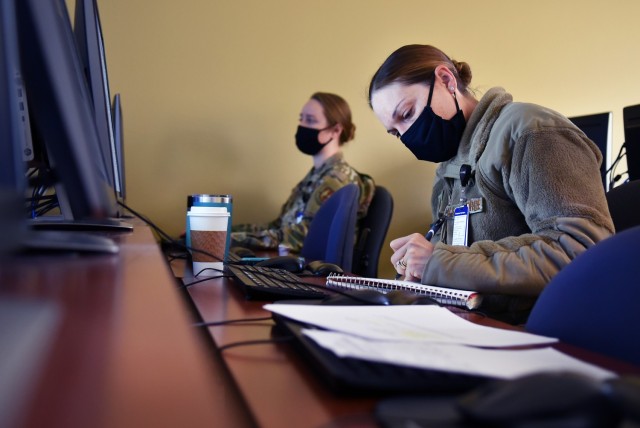 U.S. Air Force nurse Capt. Rachel Auger, assigned to the 62nd Medical Brigade, based out of Joint Base Lewis-McCord, Wash., trains on Sanford Health Medical Center's electronic medical records system, Nov. 24, 2020. Sanford Health Medical Center...