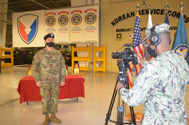 Lt. Col. Edward K. Woo, commander, Army Field Support Battalion-Northeast Asia, is interviewed by American Forces Network-Daegu Television following the Army Award for Maintenance Excellence ceremony held at Camp Carrol, Dec. 10. The battalion...