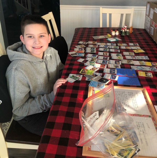 Victor Lamison, 11, smiles for a photo with his Japanese Pokémon cards and a birthday letter in Japanese and English in Nampa, Idaho, Nov. 29.