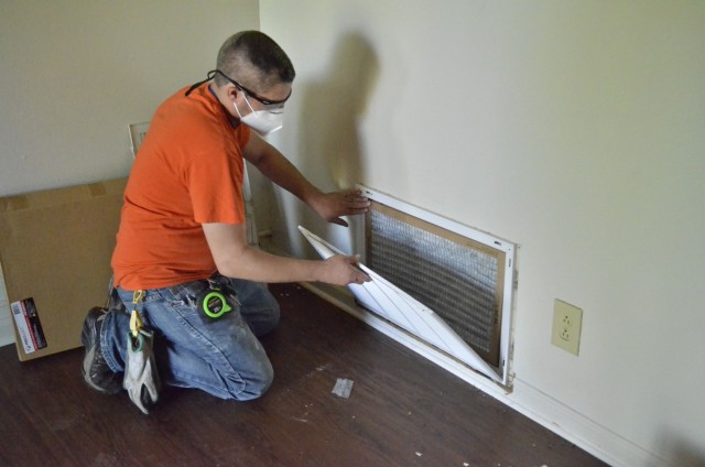 Mathew Smith, Campbell Crossing worker, replaces an air filter in a home in Pierce Village before new residents move in. The Army’s annual Tenant Satisfaction Survey was emailed Dec. 2 to residents of Campbell Crossing, a Lendlease privatized...