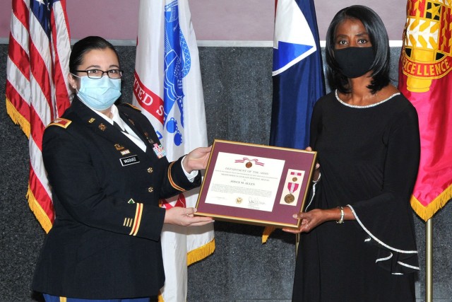 Col. Santee Vasquez (Left), Chief of Staff Tank-automotive and Armaments Command, presents Joyce Allen (Right), Secretary of the General Staff TACOM, with a Meritorious Civilian Service Medal at her retirement ceremony Dec. 9 at the Detroit Arsenal, Michigan.