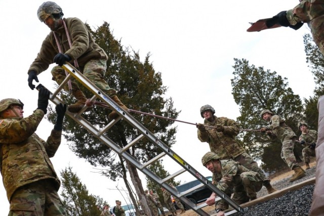 Candidates from cohort 5 attempt to traverse an obstacle at the Leader Reaction Course during the Battalion Commander Assessment Program Jan. 23, 2020, at Fort Knox, Ky. 