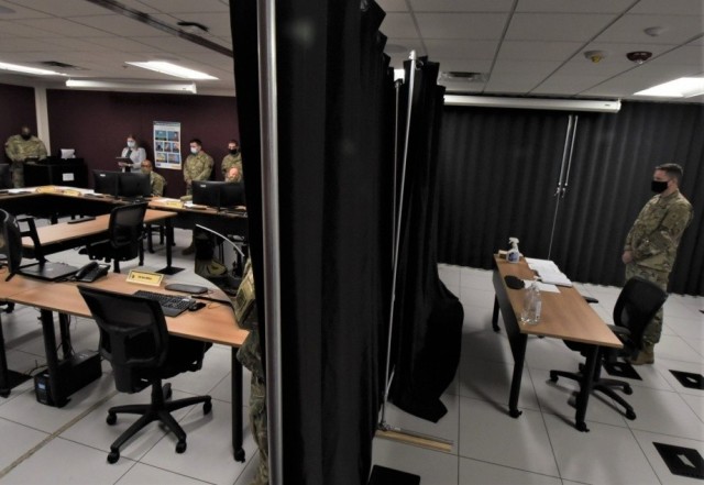 An Army officer simulates what candidates will go through when they sit down at the end of the process to participate in a double-blind panel interview with senior Army officers Aug. 11, 2020. 